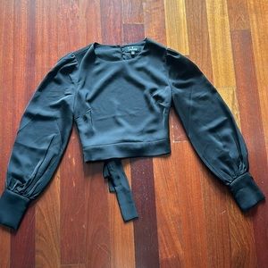 Worn once! Women’s size XS black cropped top. Satin feel. Open tie back. Lulu’s.